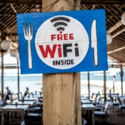 Free WiFi signage on wooden post